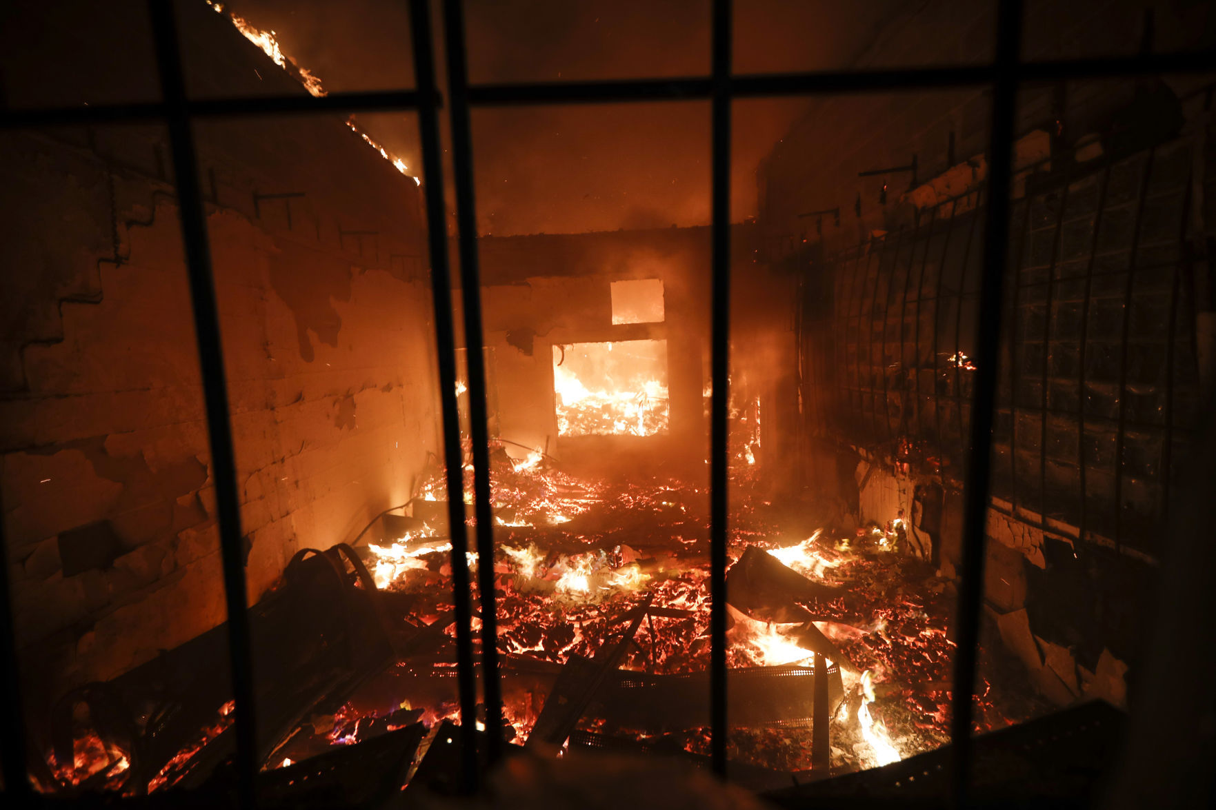 George Floyd protesters set Minneapolis police station afire